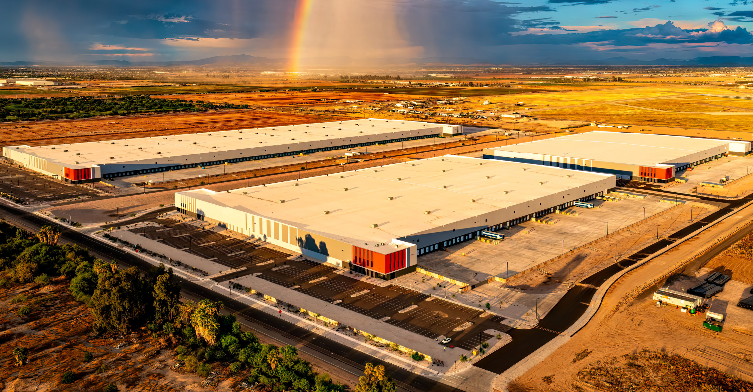 Modern industrial warehouse facility at dusk